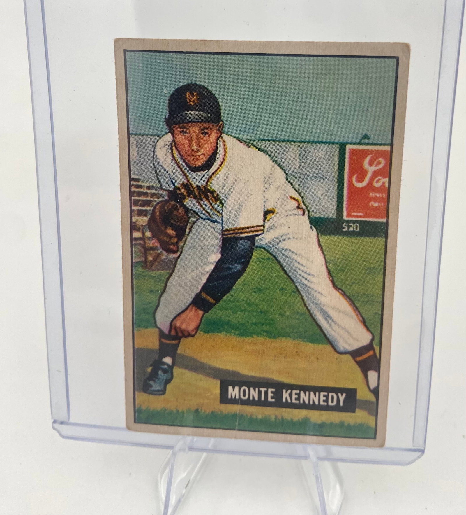 1952 Topps Monte Kennedy Baseball Card: This is a 1952 Topps baseball card featuring Monte Kennedy of the New York Giants. The vintage card depicts Kennedy in a fielding pose and shows signs of wear, particularly along the edges and corners