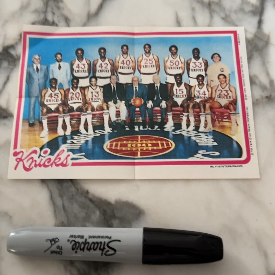 1969 Topps New York Knicks Team Pin-Up: a 1980s Topps New York Knicks team poster or pin-up card. It features the team photograph with players wearing their numbered jerseys and sitting or standing on the court. It is marked as No. 11 of 18