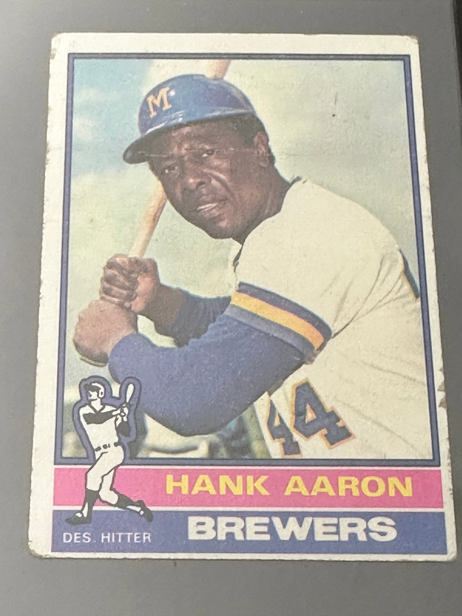 1975 Topps Hank Aaron: This is a 1975 Topps baseball card featuring Hank Aaron of the Milwaukee Brewers. The card identifies him as a designated hitter and features his portrait along with a small illustrated figure.