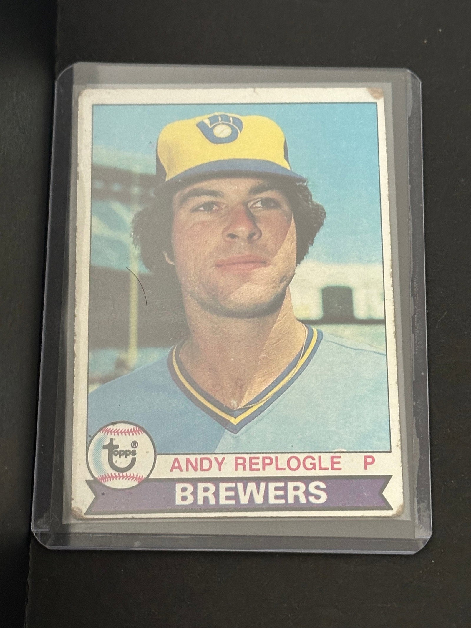 1979 Topps Andy Replogle: 1979 Topps baseball card featuring Milwaukee Brewers pitcher Andy Replogle. The card displays a portrait of the player with the Topps brand logo and his team affiliation.