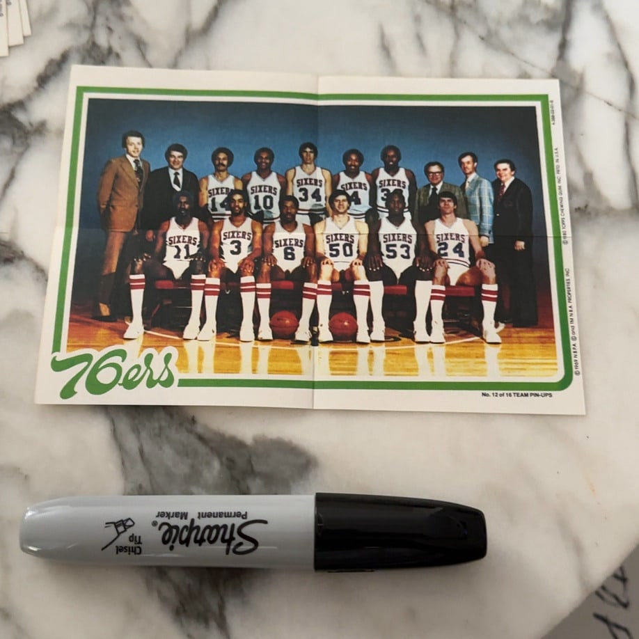 1980 Topps Philadelphia 76ers Team Pin-Up: This is a vintage 1980 Topps Philadelphia 76ers team pin-up, designated as No. 12 of 16 in the series. It features a group portrait of the basketball team, including staff and players, with the '76ers