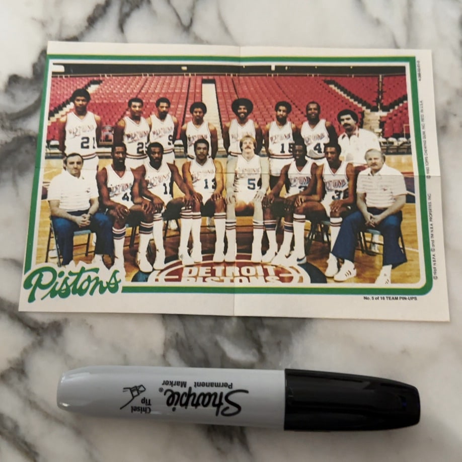 1983 Topps Detroit Pistons Team Pin-Up: This is a 1983 Topps Team Pin-Up featuring the Detroit Pistons basketball team. The piece shows a full team portrait and is marked as No. 5 of 16 in the series.