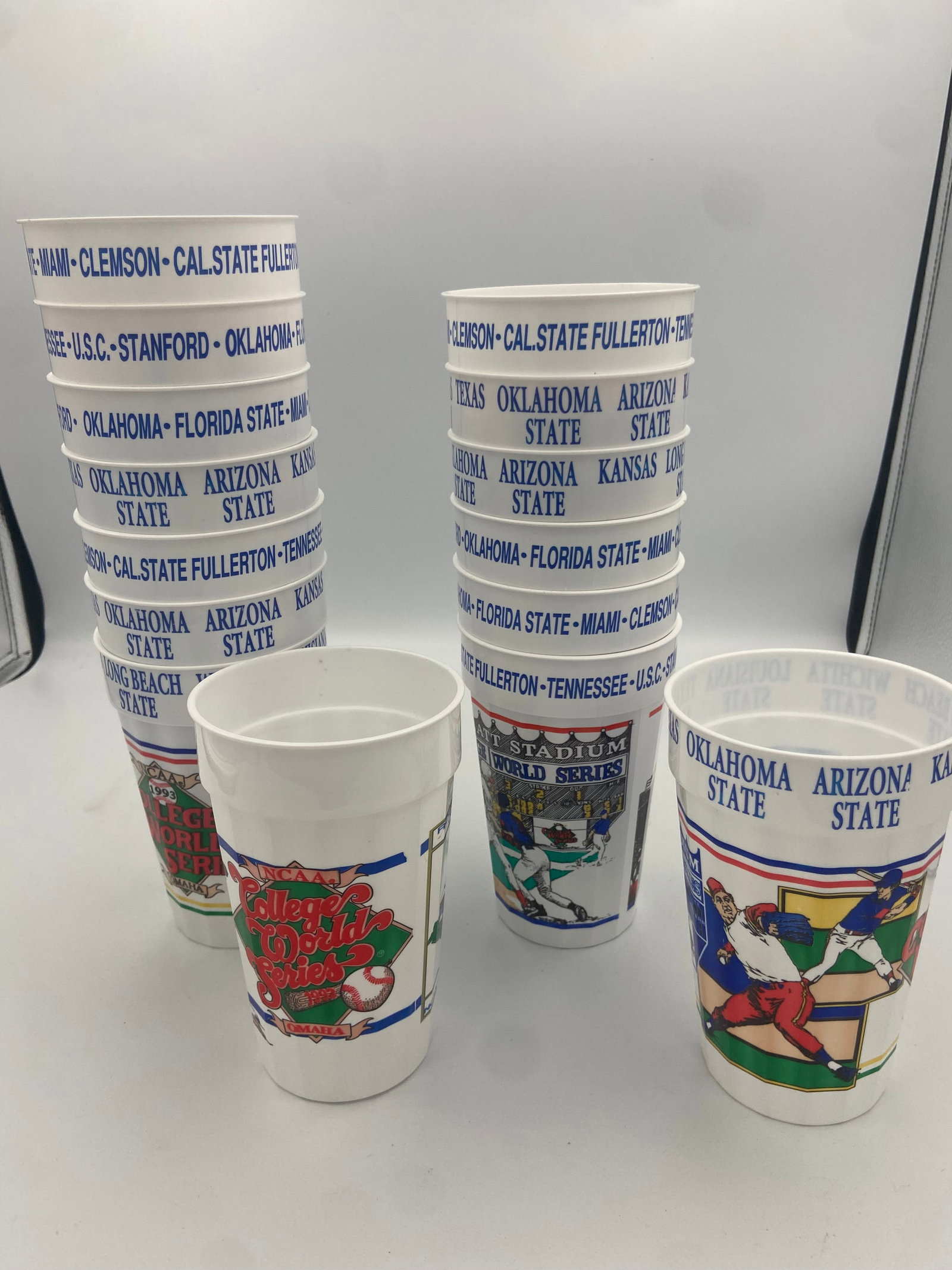 1993 NCAA College World Series Souvenir Cups: A set of souvenir cups featuring the 1993 NCAA College World Series branding. The cups display the names of various competing university baseball teams, including Oklahoma State, Arizona State, and