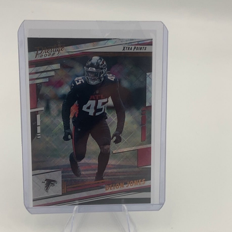 2022 Prestige Deion Jones Xtra Points: 2022 Panini Prestige trading card featuring Deion Jones of the Atlanta Falcons. The card is labeled as an Xtra Points parallel edition.