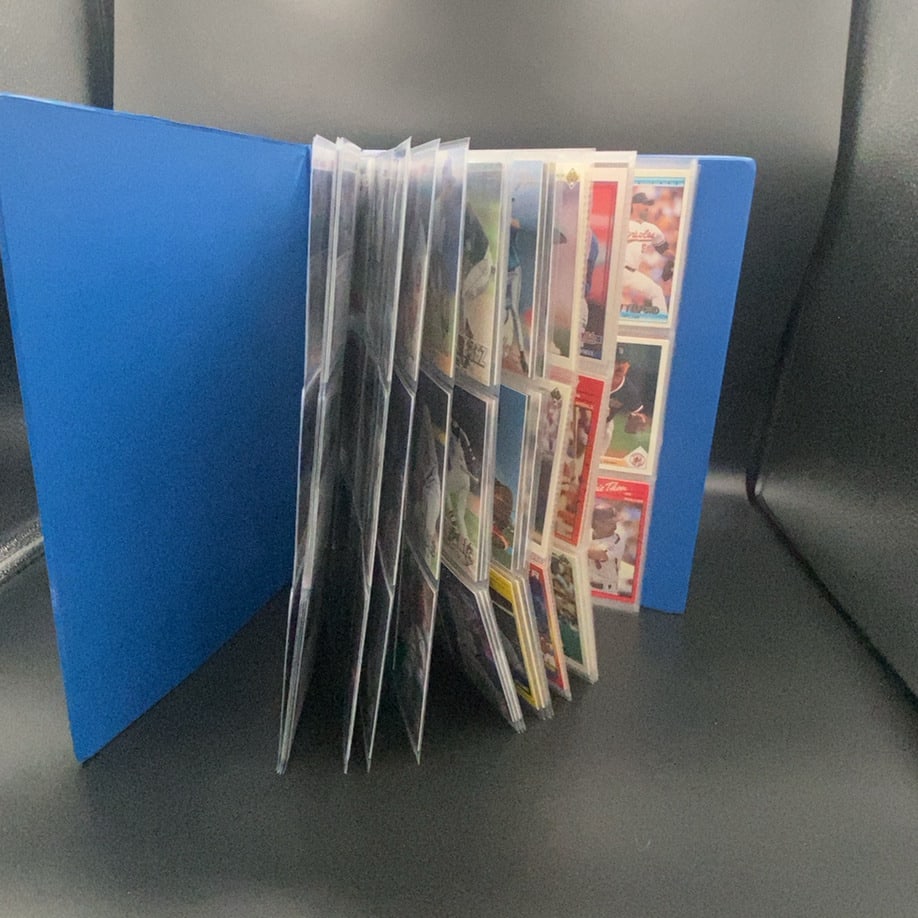 Sports Card Collection Binder: baseball trading cards stored in a binder page. The visible cards feature various MLB players