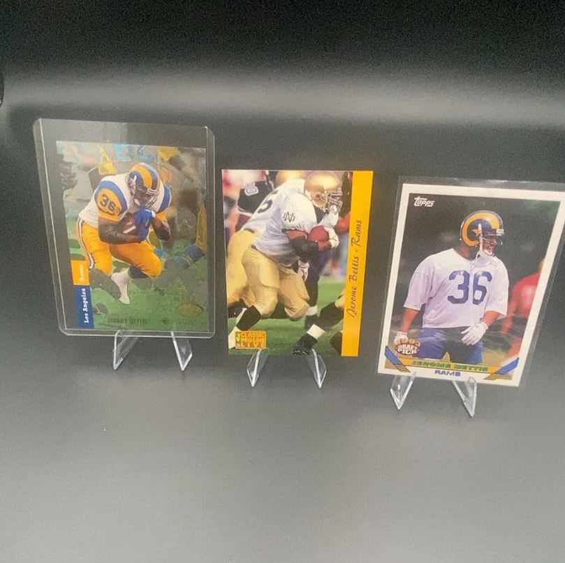 Jerome Bettis Football Card Lot: This lot features three football cards of Jerome Bettis, including a 1993 Topps Draft Pick card. The cards display Bettis in his Rams uniform and his Notre Dame collegiate attire. These are vintage
