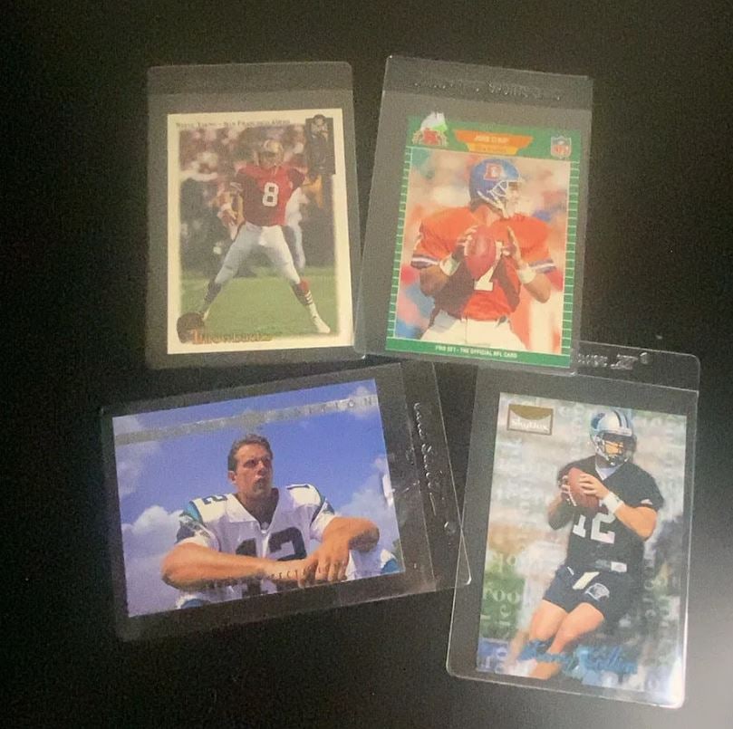 Vintage NFL Football Trading Card Collection (4 Cards): This lot features a collection of four vintage NFL football trading cards. The visible cards include Steve Young, John Elway, and Kerry Collins, produced by brands such as Pro Set and SkyBox.