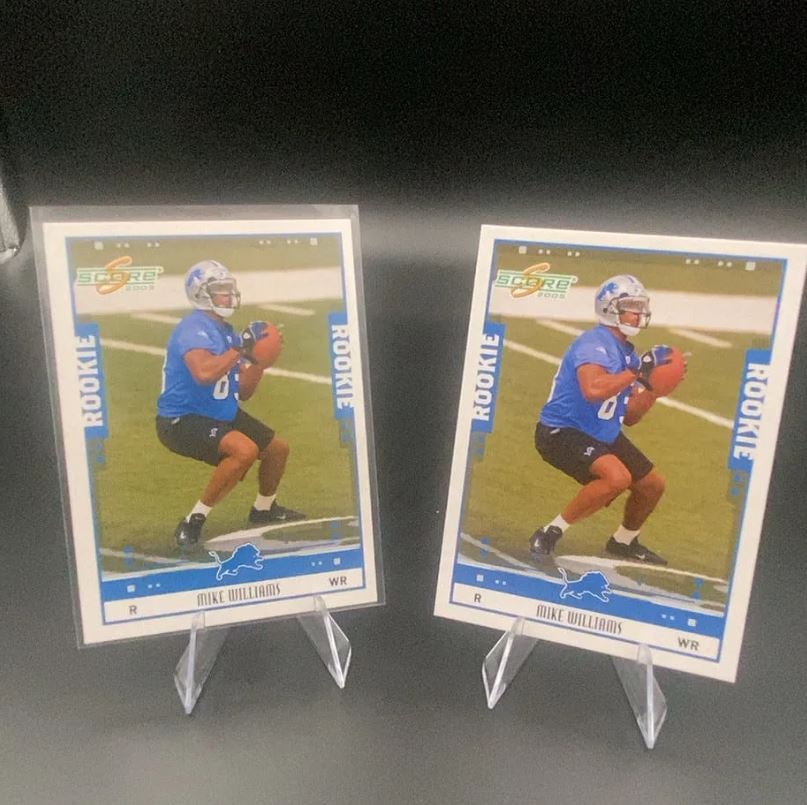 2005 Score Mike Williams: This is a 2005 Score rookie trading card featuring Mike Williams of the Detroit Lions. The card showcases action photography of the wide receiver on the field. There are two copies of this card shown