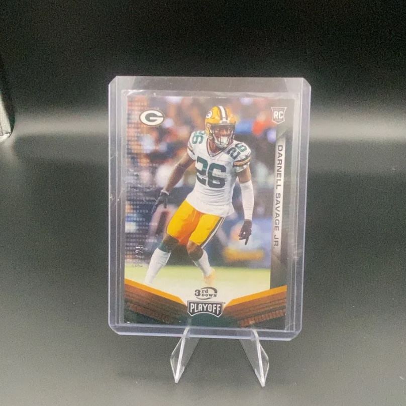 2019 Playoff Darnell Savage Jr.: This is a 2019 Playoff rookie football card featuring Darnell Savage Jr. of the Green Bay Packers. The card is encased in a protective sleeve and top loader, identifying it as a 3rd Down insert from