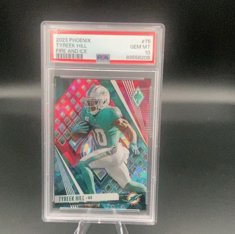 2023 Phoenix Tyreek Hill Fire and Ice: This is a 2023 Phoenix trading card featuring NFL wide receiver Tyreek Hill of the Miami Dolphins. The card is a Fire and Ice parallel, graded PSA 10 GEM MT.