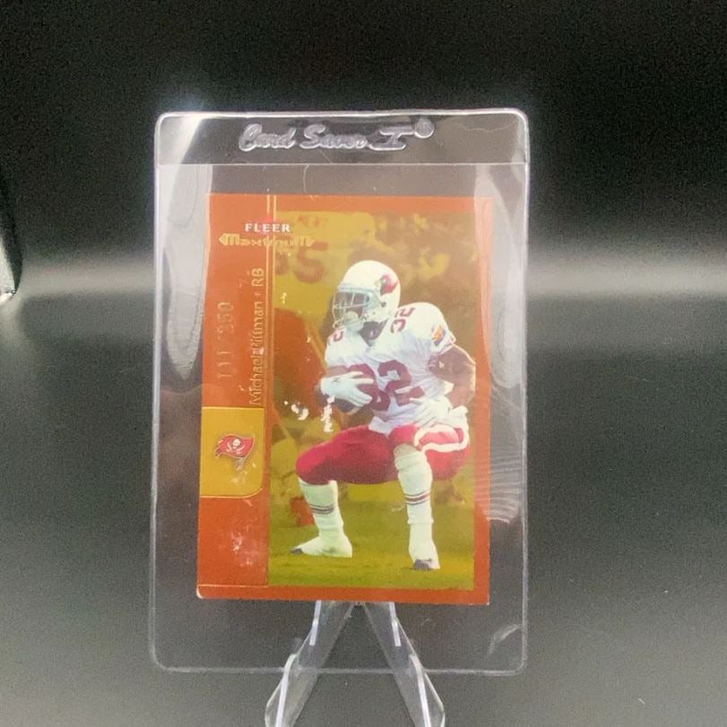 Fleer Maximum Michael Pittman: This is a Fleer Maximum football card featuring running back Michael Pittman. The card shows the player in his Tampa Bay Buccaneers uniform and includes a serial number of 111/250.