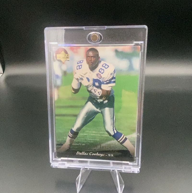 1994 Upper Deck Michael Irvin: This is a 1994 Upper Deck football card featuring Michael Irvin of the Dallas Cowboys. The card shows Irvin in his team uniform and is protected in a magnetic card holder.