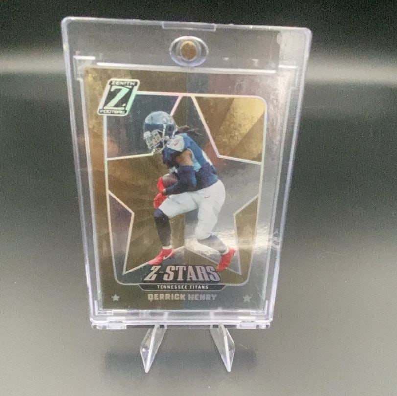 Zenith Z-Stars Derrick Henry: This is a Zenith Z-Stars trading card featuring Tennessee Titans running back Derrick Henry. The card is encased in a protective magnetic hard case.