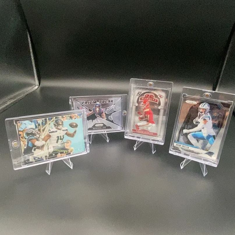 2024 Panini Football Trading Card Lot: This lot features four 2024 Panini football trading cards displayed in magnetic cases. The collection includes notable players such as Nico Collins, Xavier Worthy, and Adam Thielen in various sets