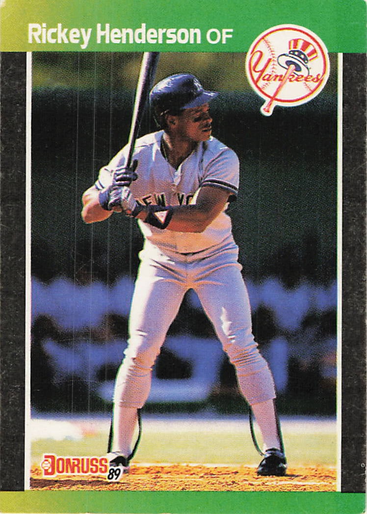 1989 Donruss Rickey Henderson New York Yankees Card: This is a 1989 Donruss baseball card featuring Baseball Hall of Famer Rickey Henderson, card number 634. The image depicts Henderson in his New York Yankees batting stance. The card displays