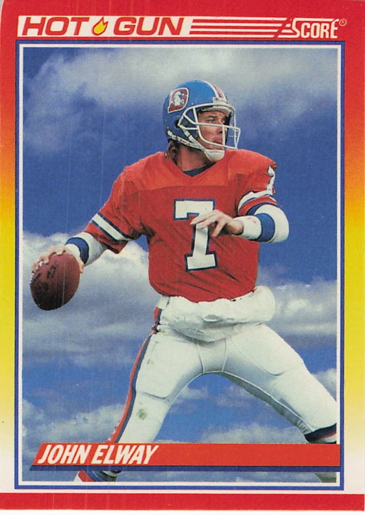 1990 Score Football #564 John Elway trading card: This is a 1990 Score Football trading card featuring John Elway, card number 564. The card showcases Elway, the legendary quarterback for the Denver Broncos, during his NFL career. It is a standard