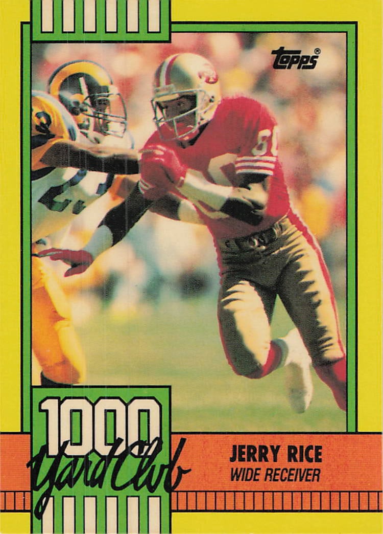 1990 Topps 1000 Yard Club #1 Jerry Rice football trading card: This is a 1990 Topps Football trading card featuring Jerry Rice, card number 1. It is part of the “1000 Yard Club” subset, recognizing Rice for his outstanding receiving performance with