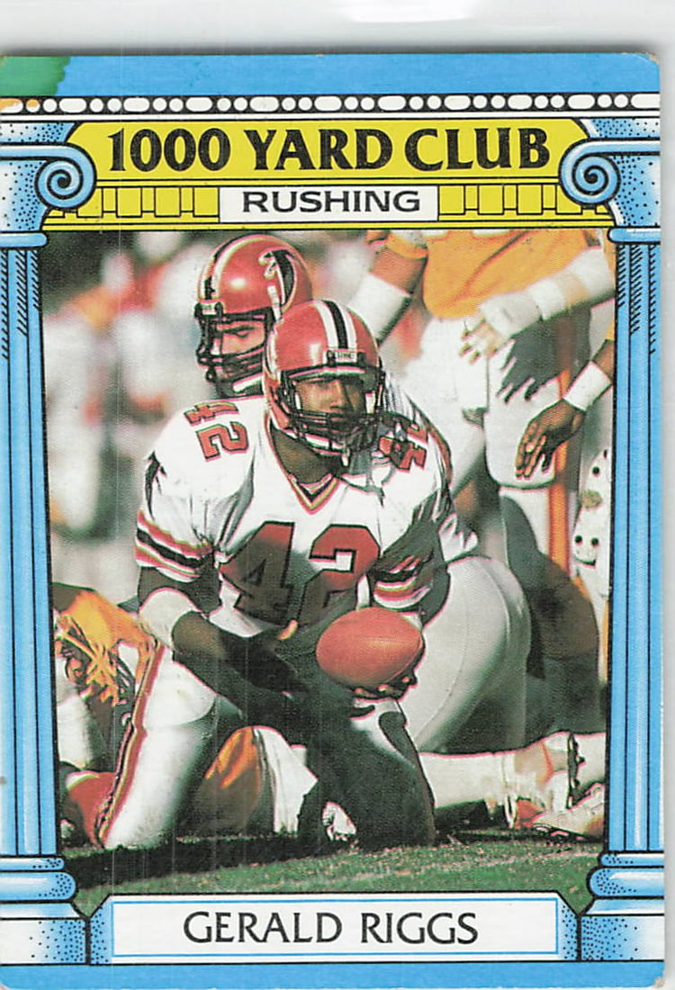 1987 Topps Gerald Riggs 1000 Yard Club Football Card: This is a 1987 Topps football card, card number 203, featuring Gerald Riggs of the Atlanta Falcons. The card is part of the '1000 Yard Club' subset, highlighting his impressive rushing performance.