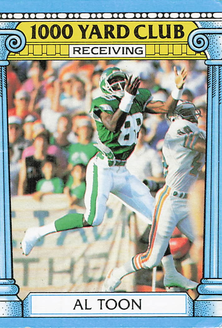 1989 Pro Set Al Toon 1000 Yard Club Football Card: This is a 1989 Pro Set football card featuring New York Jets wide receiver Al Toon. The card is part of the 1000 Yard Club subset, highlighting his impressive receiving performance. It is a standard