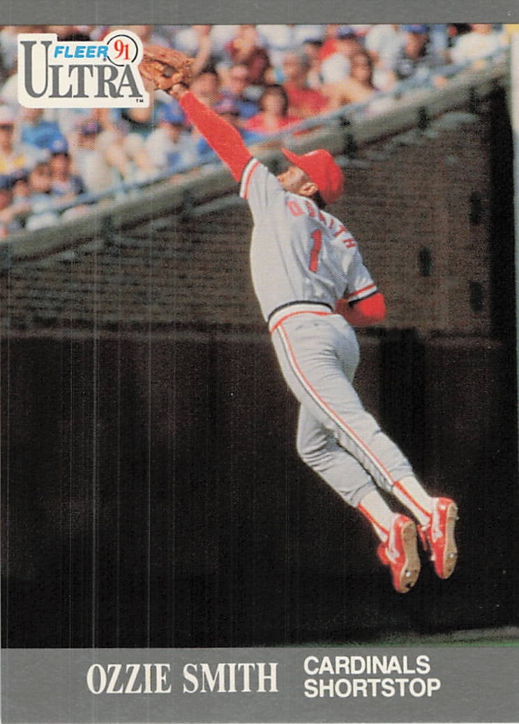 1991 Fleer Ultra Ozzie Smith St. Louis Cardinals Card: This is a 1991 Fleer Ultra baseball card, card number 217, featuring Hall of Fame shortstop Ozzie Smith of the St. Louis Cardinals. The image showcases Smith's iconic defensive prowess with an action 