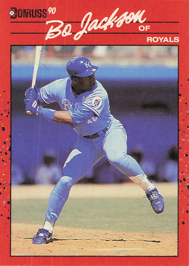 1990 Donruss Bo Jackson Kansas City Royals Baseball Card: This is a 1990 Donruss baseball card featuring iconic multi-sport athlete Bo Jackson in his Kansas City Royals uniform. The card, card number 494, captures Jackson in a dynamic batting stance with the
