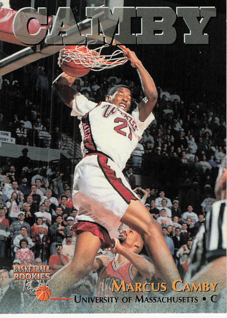 1996-97 Score Board Marcus Camby Rookie Card: This is a 1996-97 Score Board Basketball Rookies card featuring Marcus Camby of the University of Massachusetts. The card showcases a dynamic action shot of Camby dunking while wearing his college jer