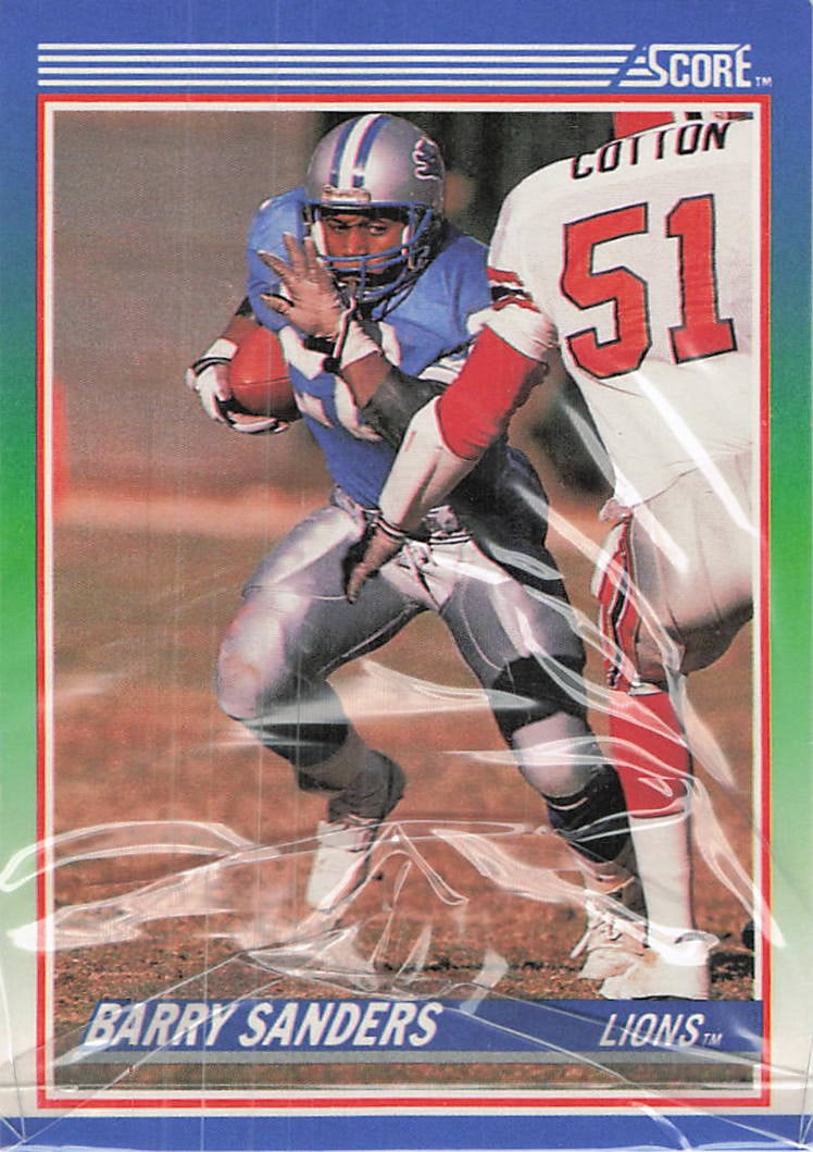 1990 Score Barry Sanders Detroit Lions Football Card: This is a 1990 Score football card featuring legendary Hall of Fame running back Barry Sanders of the Detroit Lions. Card number 355 captures Sanders in action, eluding opposing linebacker James