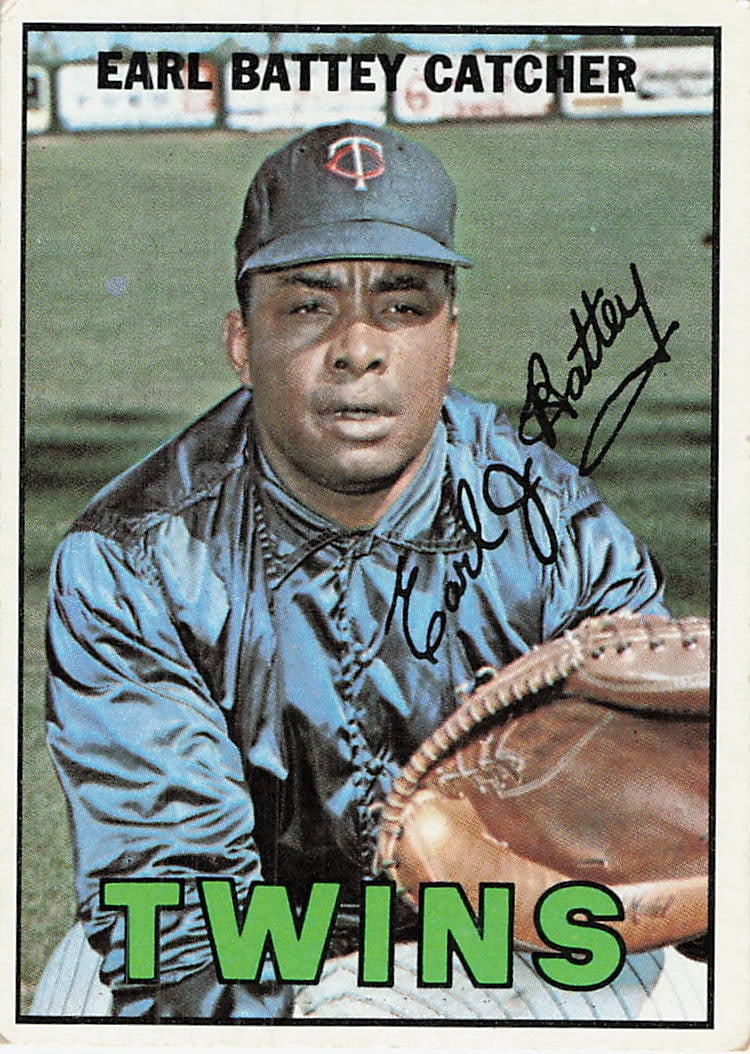 1967 Topps #15 Earl Battey baseball card: This is a 1967 Topps #15 Earl Battey baseball card, featuring Minnesota Twins catcher Earl Battey. The card displays a portrait of Battey wearing his team uniform and cap, and it is notable for
