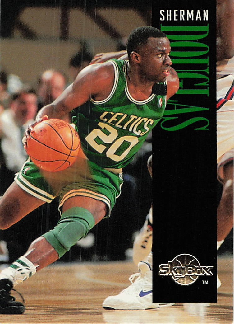 1991-92 SkyBox Sherman Douglas Boston Celtics Card: This is a 1991-92 SkyBox basketball card featuring Sherman Douglas of the Boston Celtics. The card captures a dynamic action shot of Douglas dribbling in his Celtics uniform with the iconic vertical