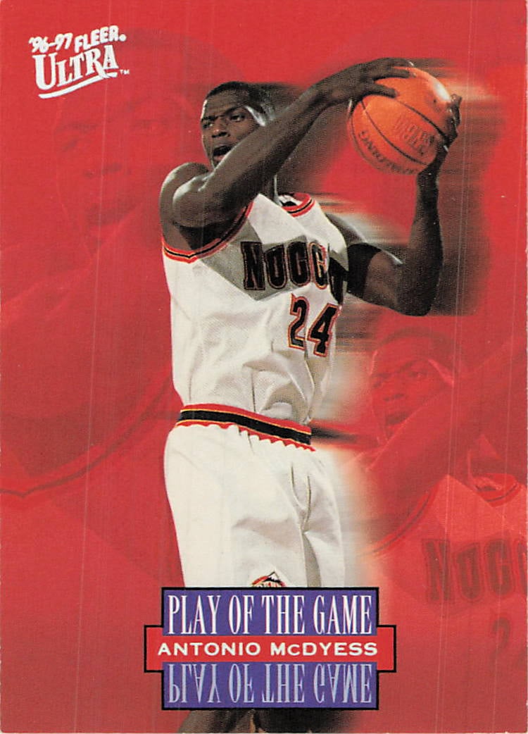 1996-97 Fleer Ultra Antonio McDyess Play of the Game: This is a 1996-97 Fleer Ultra 'Play of the Game' insert card featuring Antonio McDyess of the Denver Nuggets. The card showcases a striking design with a bold red background and dynamic imagery of the