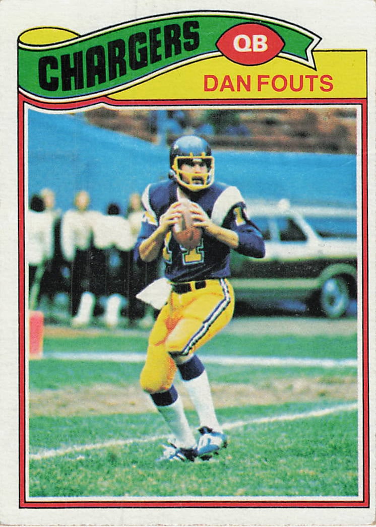 1977 Topps Dan Fouts San Diego Chargers Football Card: This is a 1977 Topps football card, number 270, featuring Hall of Fame quarterback Dan Fouts of the San Diego Chargers. The card displays a classic vintage design with a team banner at the top and