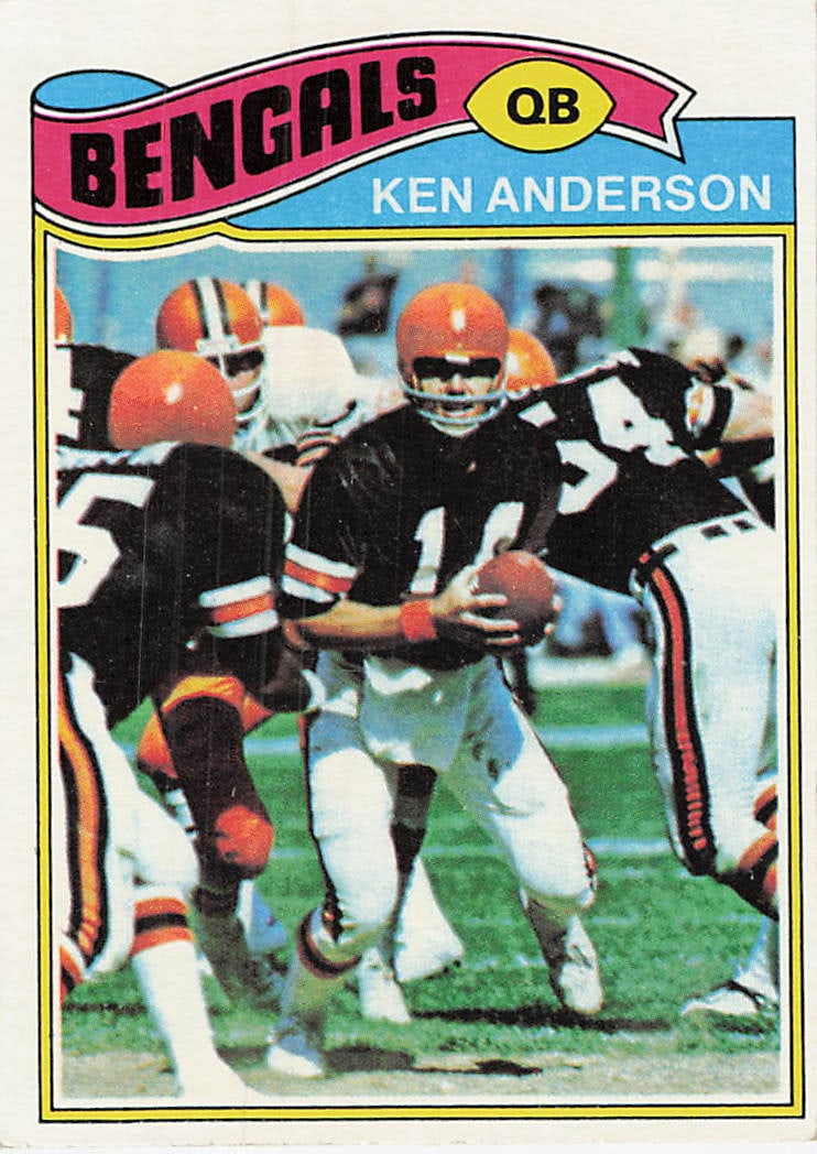 1977 Topps Ken Anderson Cincinnati Bengals Football Card: This is a 1977 Topps football card featuring Cincinnati Bengals quarterback Ken Anderson, card number 210. The card showcases a classic action photograph of Anderson holding the football on the