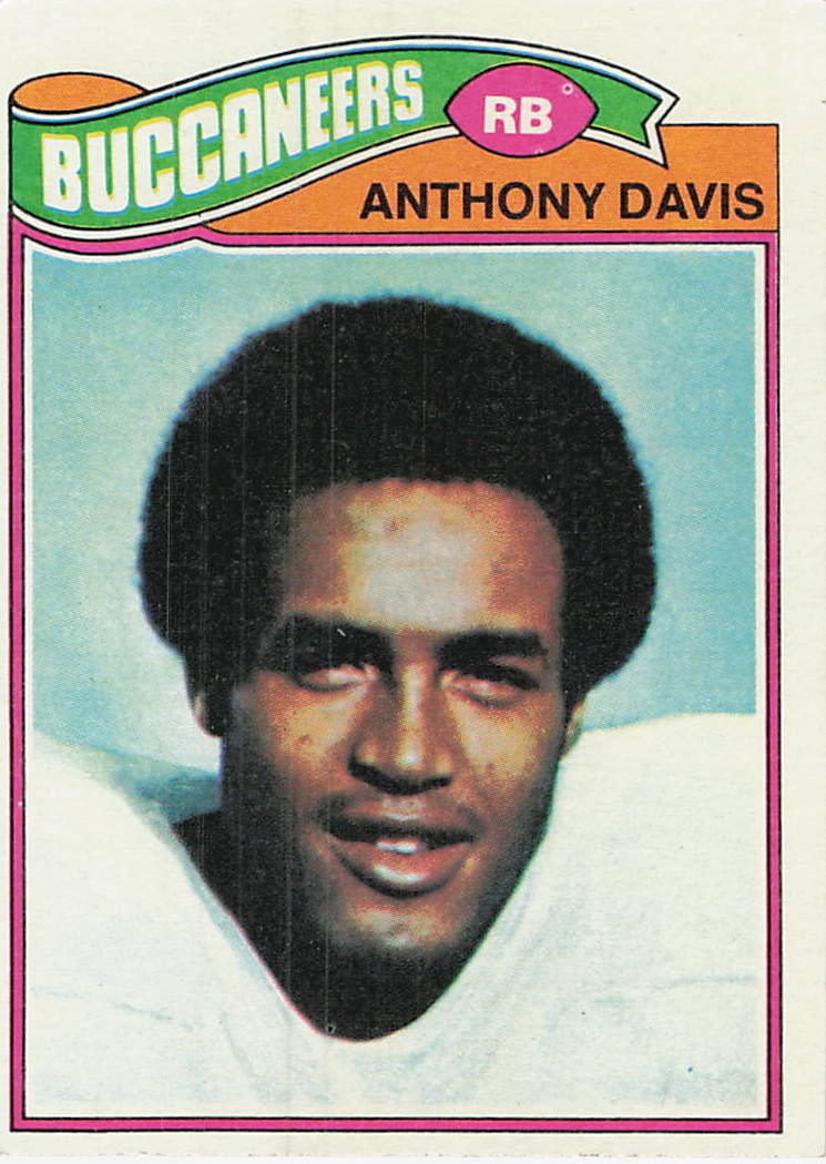 1977 Topps Football Anthony Davis Tampa Bay Buccaneers Card: This is a 1977 Topps Football card featuring Tampa Bay Buccaneers running back Anthony Davis. The card showcases a classic portrait-style design with the team name and player position prominently