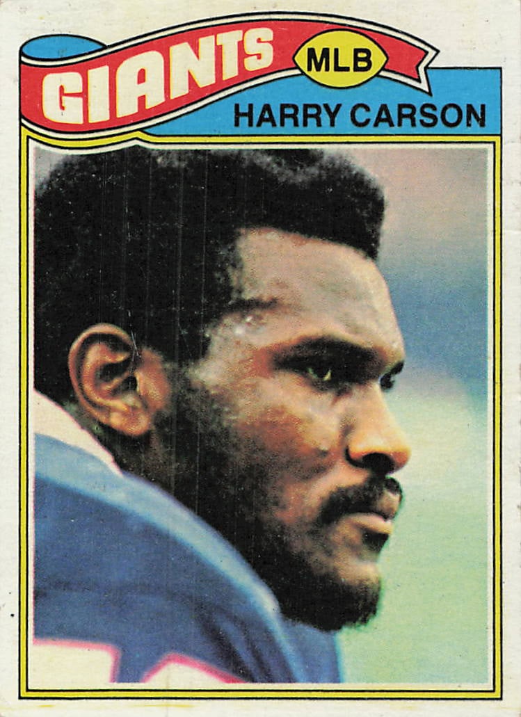 1977 Topps Harry Carson New York Giants Football Card: This is a 1977 Topps football card featuring Pro Football Hall of Famer Harry Carson of the New York Giants. The card highlights a close-up portrait of the legendary linebacker. It exhibits signs of