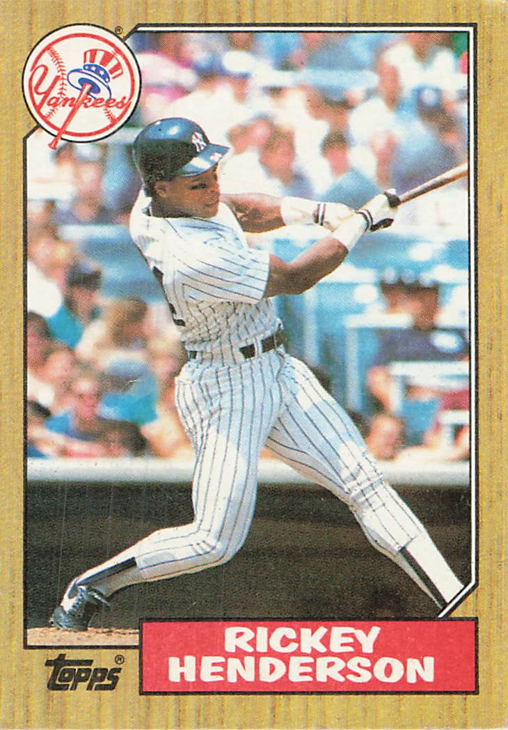 1990 Topps Rickey Henderson New York Yankees Card: This is a 1990 Topps baseball card featuring Baseball Hall of Famer Rickey Henderson, card number 210, during his tenure with the New York Yankees. The card features a classic wood-grain border design