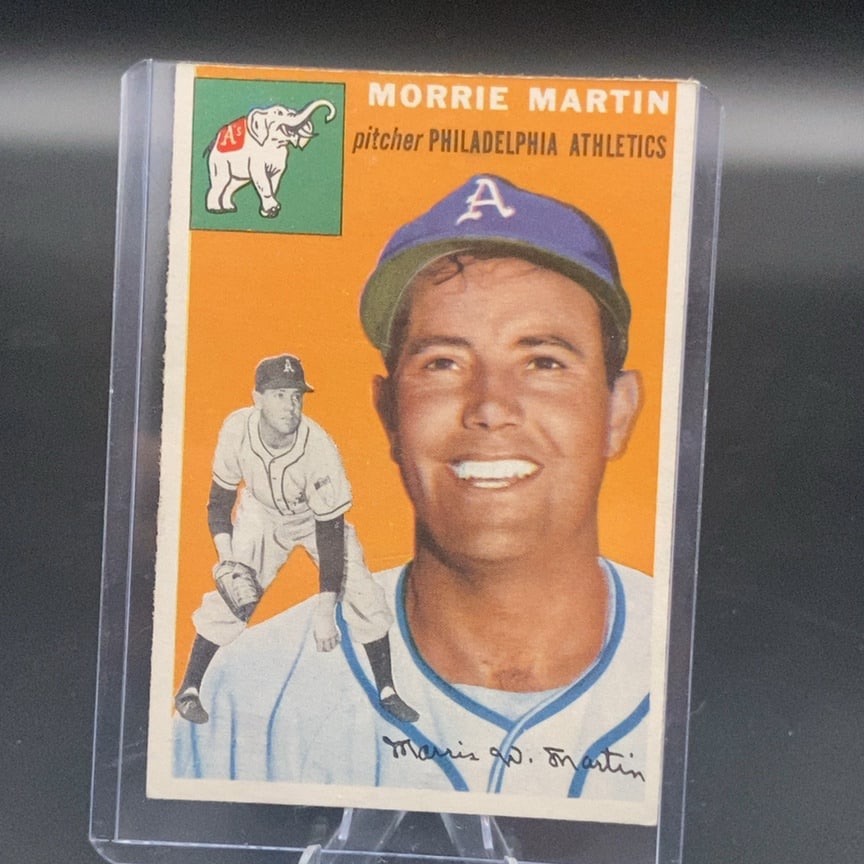 1954 Topps Baseball Card #168 featuring pitcher Morrie Martin: This is a 1954 Topps baseball card (card number 168) featuring pitcher Morrie Martin of the Philadelphia Athletics. The card showcases a classic design with a vibrant orange background, a portrait of