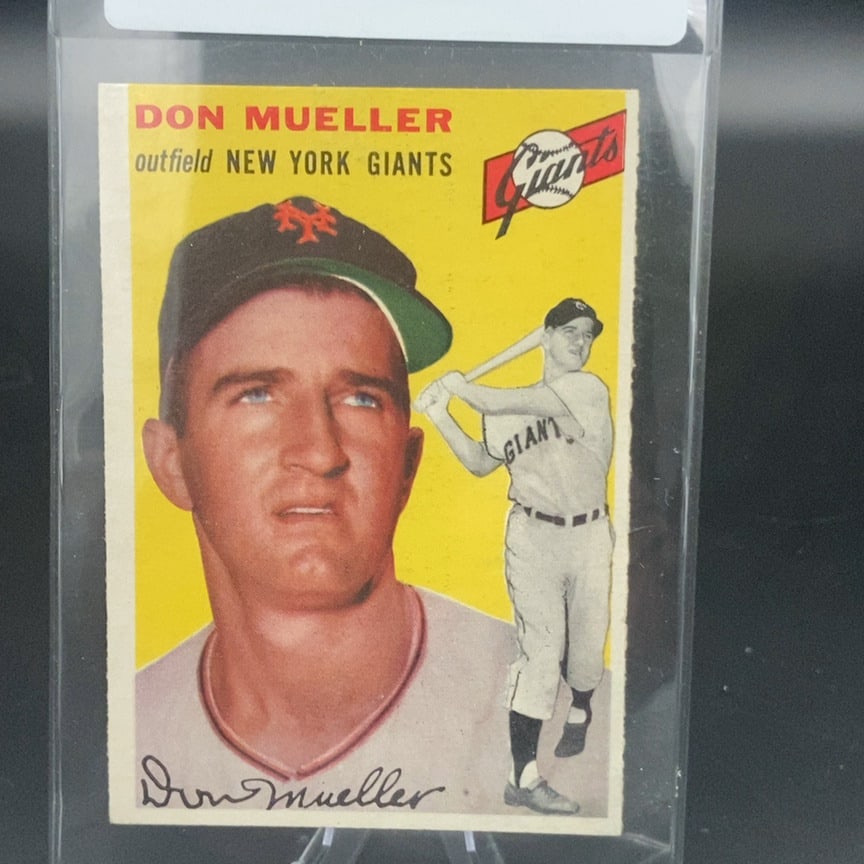 1954 Topps #42 Don Mueller baseball card: This is a vintage baseball card featuring Don Mueller of the New York Giants. The card includes both a portrait shot and an action image of the outfielder batting, along with a facsimile autograph.