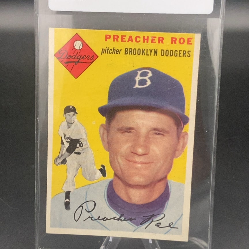 1954 Topps #14 Preacher Roe baseball card: This is a 1954 Topps baseball card featuring Preacher Roe, a former Major League Baseball pitcher best known for his time with the Brooklyn Dodgers. The card features Roe in his baseball uniform with