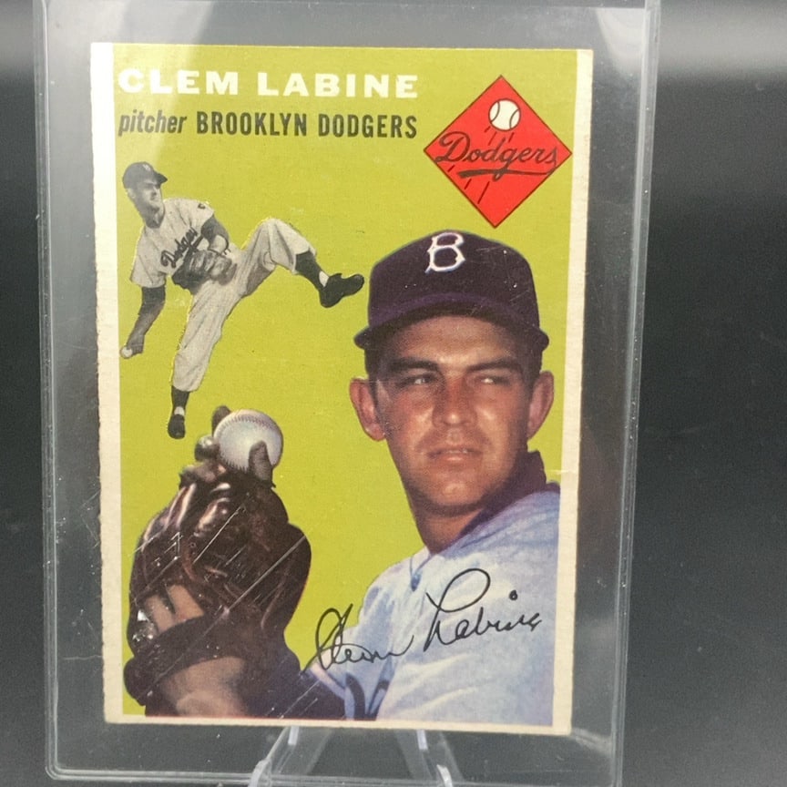 1954 Topps baseball card of Brooklyn Dodgers pitcher Clem Labine: This is a 1954 Topps baseball card featuring Brooklyn Dodgers pitcher Clem Labine. The card design includes a portrait of the player alongside an action shot and a printed autograph signature.