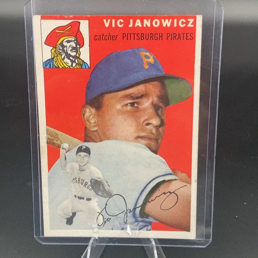 1954 Topps #16 Vic Janowicz baseball card: This is a 1954 Topps baseball card featuring Pittsburgh Pirates player Vic Janowicz. The card includes a portrait of the player alongside a smaller action image and a facsimile autograph.
