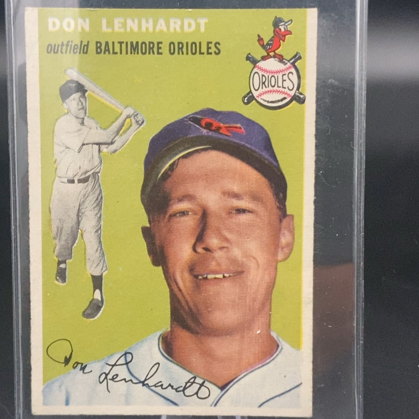 1954 Topps Don Lenhardt #157 baseball card: This is a vintage baseball card featuring Don Lenhardt as an outfielder for the Baltimore Orioles. The card displays a portrait of the player along with a smaller action shot of him batting and the