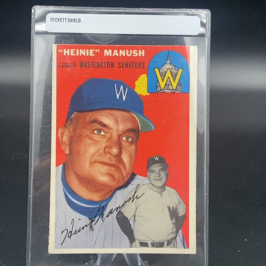 1954 Topps #187 Heinie Manush baseball card: This is a vintage baseball card featuring Heinie Manush, who is identified as a coach for the Washington Senators. The card includes a portrait and a full-body action shot, along with a facsimile