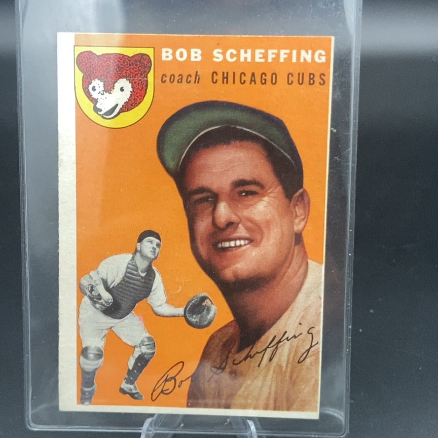 1954 Topps #76 Bob Scheffing baseball card: This is a 1954 Topps baseball card featuring Bob Scheffing, identified as the coach of the Chicago Cubs. The card features a portrait of Scheffing with a smaller action shot of a catcher and the