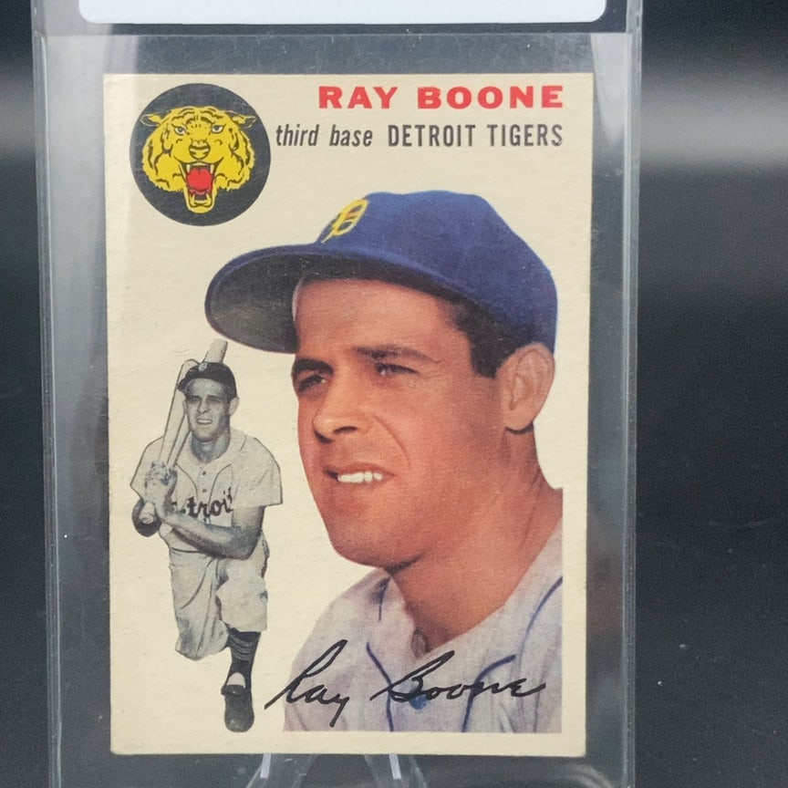 1954 Topps #77 Ray Boone baseball card: This is a vintage trading card featuring Ray Boone of the Detroit Tigers. The card displays his name in red at the top, his position, team, and a stylized tiger logo. A signature is printed across