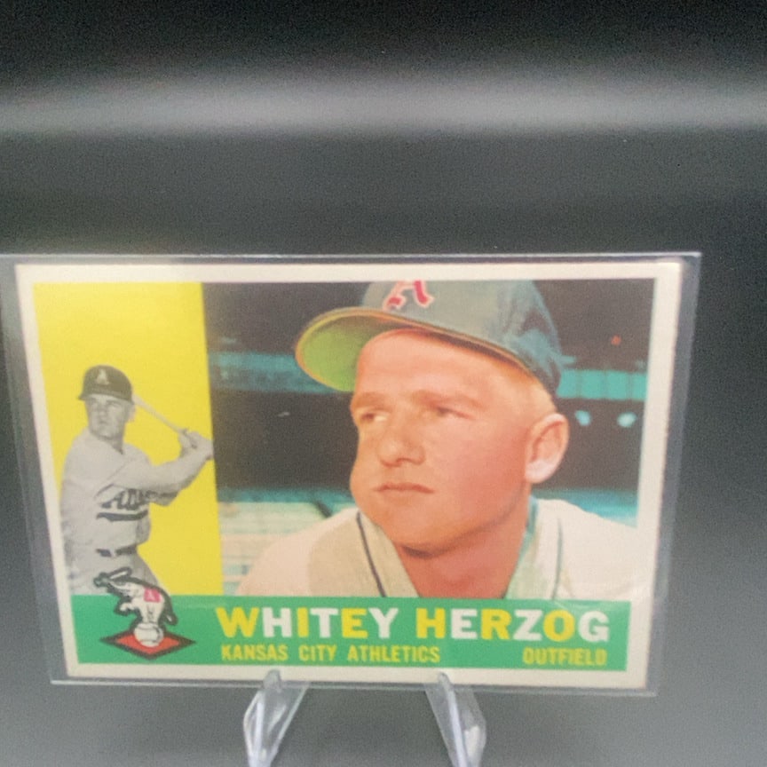 1960 Topps Whitey Herzog #92 baseball trading card: This is a 1960 Topps baseball card featuring Whitey Herzog of the Kansas City Athletics. The card features a portrait and a separate action shot of the outfielder in his team uniform.