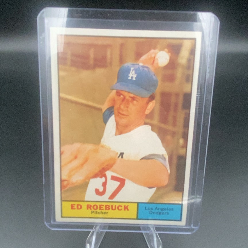 1961 Topps Baseball Card #6 of Ed Roebuck: This is a 1961 Topps baseball card featuring Ed Roebuck of the Los Angeles Dodgers. The card shows Roebuck in a pitching motion with his uniform number 37 visible. It is encapsulated in a protective