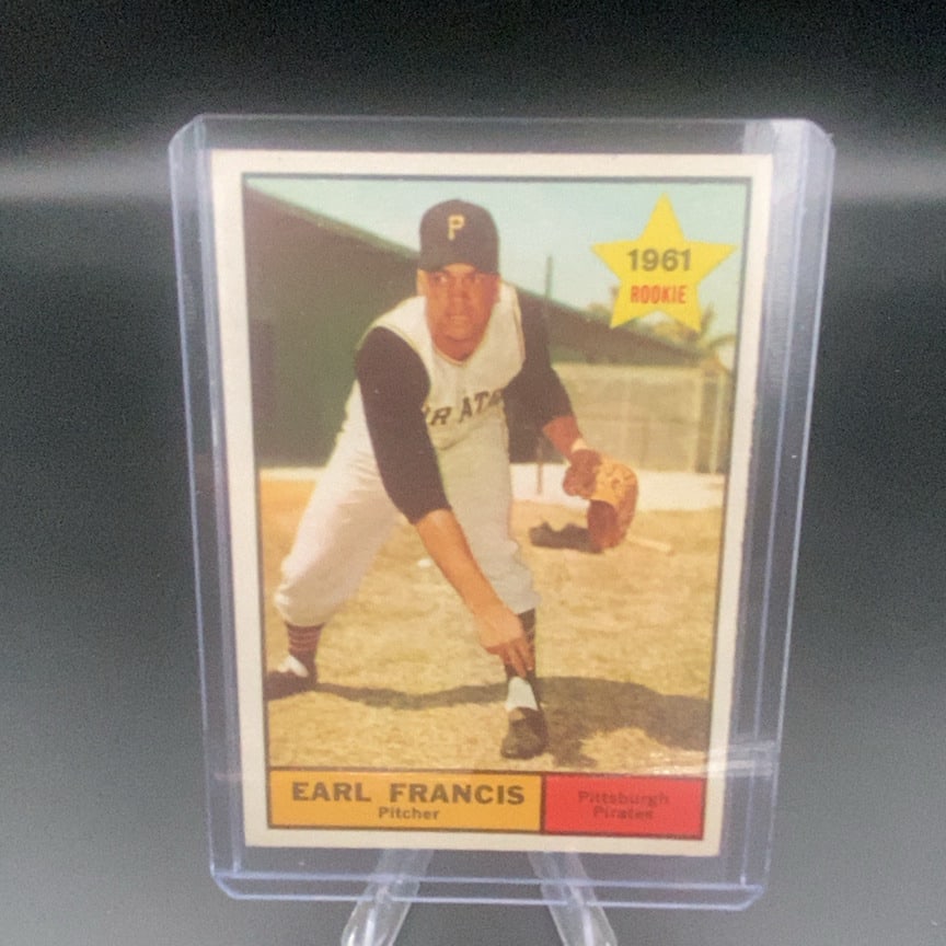 1961 Topps #54 Earl Francis Pittsburgh Pirates rookie trading card: This is a 1961 Topps baseball card featuring Pittsburgh Pirates pitcher Earl Francis. It is marked as a rookie card and includes a distinctive yellow star design with the year and rookie designation.