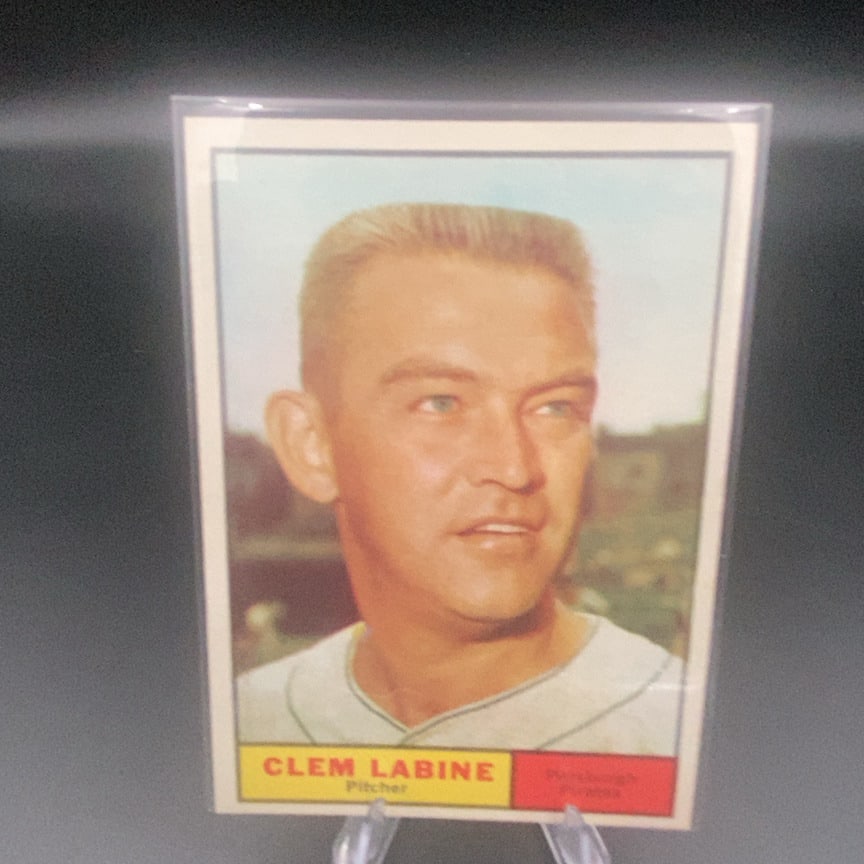 1961 Topps #22 Clem Labine baseball trading card: This is a vintage 1961 Topps baseball card featuring Pittsburgh Pirates pitcher Clem Labine. The card shows a close-up portrait of the player with his name and position displayed on a yellow banner