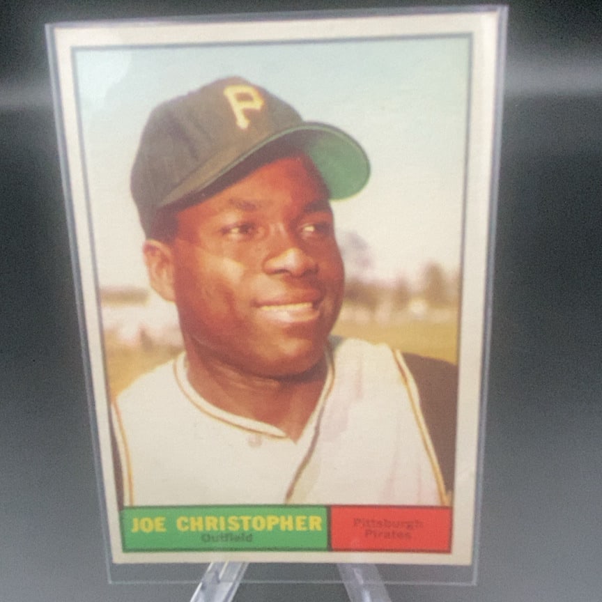 1961 Topps #82 Joe Christopher baseball card: This is a vintage trading card featuring Joe Christopher, an outfielder for the Pittsburgh Pirates. The card features a portrait of the player and lists his team and position.