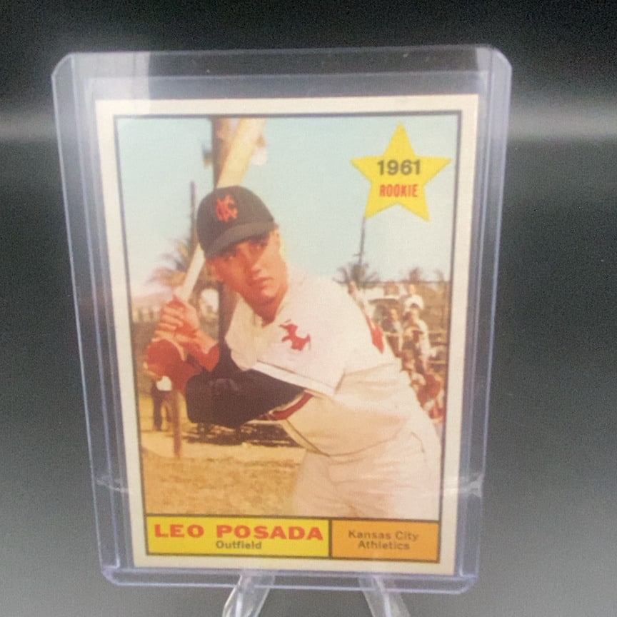 1961 Topps #39 Leo Posada baseball trading card: This is a 1961 Topps baseball card featuring Leo Posada of the Kansas City Athletics. The card is marked with a 1961 Rookie star graphic in the top right corner. The card is preserved in a protective